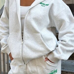 White Fox Zip-Up Hoodie with Green Logo Size M/L 65.00 New with tags